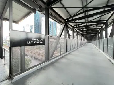 a walkway in a building with a sign that reads canyon left station at KL Sentral Loft, EST Bangsar #3A in Kuala Lumpur