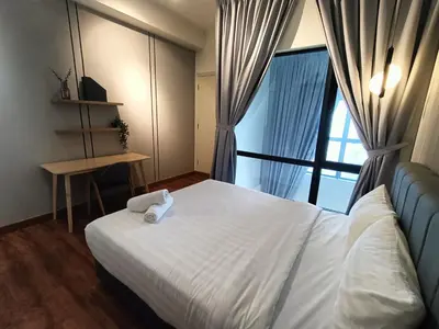 a hotel room with a bed and a window at Nj Homestay at Arte Mont Kiara in Kuala Lumpur