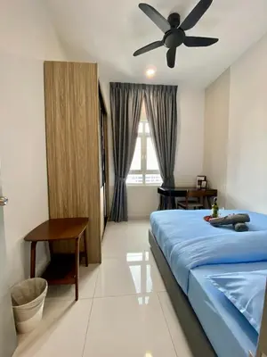 a bedroom with a bed and a ceiling fan at TR Residence Near Titiwangsa LRT By Iconique in Kuala Lumpur