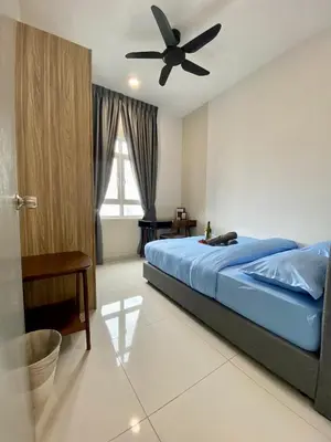 a bedroom with a bed with a ceiling fan at TR Residence Near Titiwangsa LRT By Iconique in Kuala Lumpur
