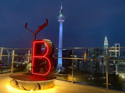 a sign with the number six sitting on top of a building at Ceylonz Suite Official in Kuala Lumpur