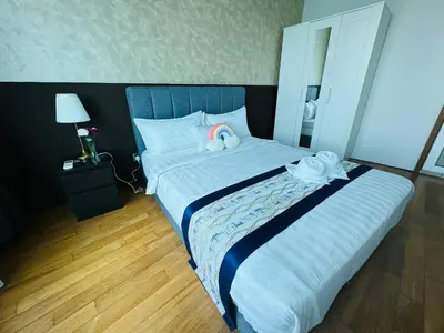 a bedroom with a large bed with two towels on it at Vortex Suites klcc by Rit in Kuala Lumpur