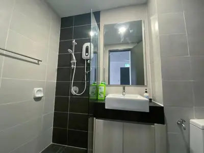a bathroom with a sink and a shower and a mirror at Lily and Loft - Queensville @ Kuala Lumpur - Netflix in Kuala Lumpur