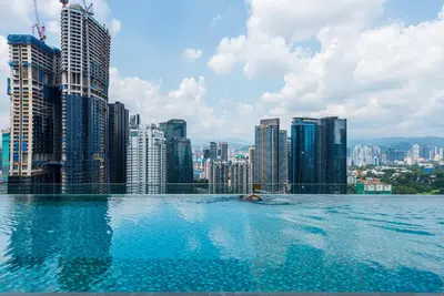 a swimming pool on top of a city skyline at Dorsett Residence Kuala Lumpur 15 in Kuala Lumpur
