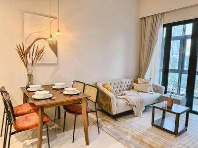 a living room with a table and a couch at TRX Garden View TriBeCa 3min walk2 Pavillion 2bedroom in Kuala Lumpur