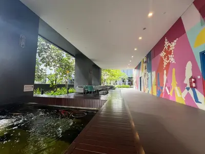 a house with a koi pond in the middle at Star Suite 5min Walk to KLCC Netflix in Kuala Lumpur