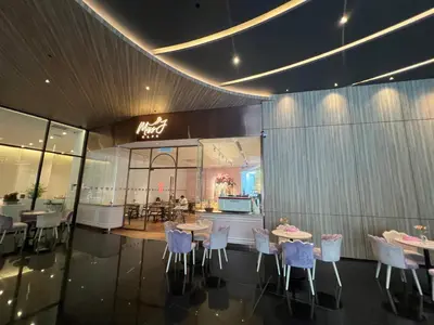 a restaurant with tables and chairs in a building at Star Suite 5min Walk to KLCC Netflix in Kuala Lumpur