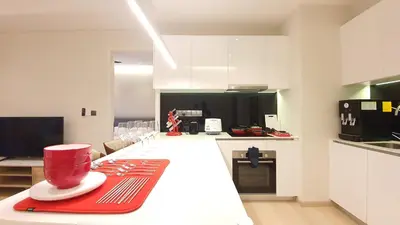 a kitchen with a white counter top with a reducer on it at Star Suite 5min Walk to KLCC Netflix in Kuala Lumpur