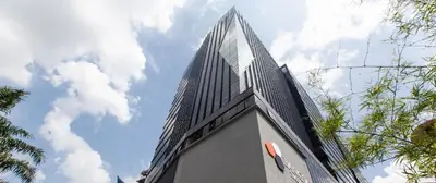 a tall building with a sky in the background at The Parkville - Bangsar Trade Centre in Kuala Lumpur