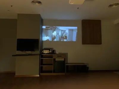 a room with a tv and a desk with a counter sidx sidx sidx at The Luxmi - Bangsar Trade Centre in Kuala Lumpur