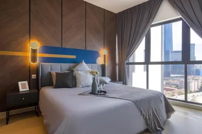 a bedroom with a large bed and a large window at Continew Residensi by Airhost in Kuala Lumpur