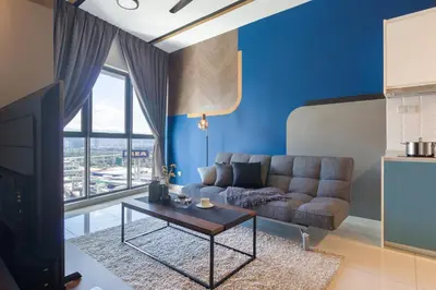a living room with a couch and a table at Continew Residensi by Airhost in Kuala Lumpur