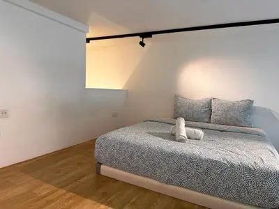 a bedroom with a bed with a stuffed animal on it at KL Sentral Loft, EST Bangsar #6, LRT in Kuala Lumpur