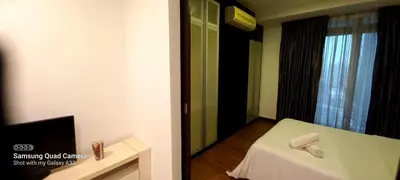 a hotel room with a bed and a mirror at Taragon BBCC in Kuala Lumpur