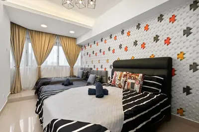 a bedroom with two beds and a wall with stars at Fahenheit 88, Kuala Lumpur 17 in Kuala Lumpur