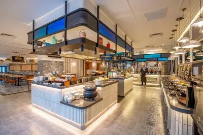 a large kitchen with a buffet in a restaurant at Santa Grand Signature Kuala Lumpur in Kuala Lumpur