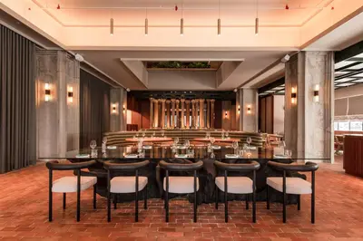 a large dining room with a table and chairs at Else Kuala Lumpur, a member of Design Hotels in Kuala Lumpur