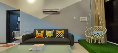 a living room with a couch and a chair at Fahrenheit 88, Kuala Lumpur 11 in Kuala Lumpur