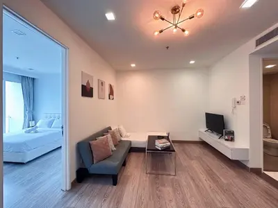 a living room with a couch and a tv and a bed at 6PAX SUITES KL CITY Pavilion at Bukit Bintang NETFLIX & WIFI in Kuala Lumpur