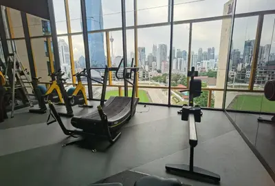 a gym with tread machines and a view of the city at Merdeka Tower 118 Chinatown TRX at Opus in Kuala Lumpur