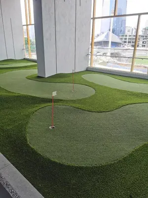 a golf course in the middle of a building at Merdeka Tower 118 Chinatown TRX at Opus in Kuala Lumpur