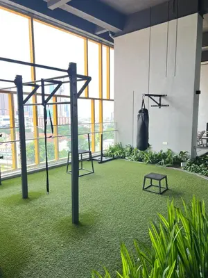 a gym with a swing set in a room with plants at Merdeka Tower 118 Chinatown TRX at Opus in Kuala Lumpur