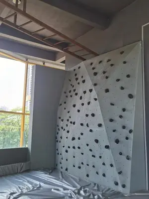 a bedroom with a large rock climbing wall at Merdeka Tower 118 Chinatown TRX at Opus in Kuala Lumpur