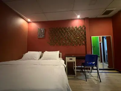 a bedroom with a bed and a desk and a chair at RHV Bukit Bintang , Kuala Lumpur in Kuala Lumpur