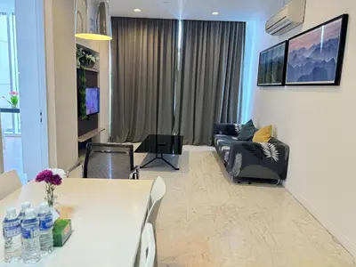 a living room with a couch and a table at The Face Platinum Suites KLCC in Kuala Lumpur