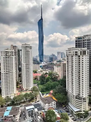 a view of a city with a tall skyscraper at Oneiro One Bukit Ceylon in Kuala Lumpur