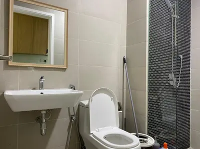 a bathroom with a sink and a toilet and a shower at Happy Continew Residence 2 Bedrooms - TRX KL in Kuala Lumpur