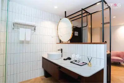 a bathroom with a sink and a mirror at STEG Kuala Lumpur in Kuala Lumpur
