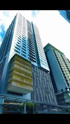 a tall building with many windows in a city at CUSHY APARTMENT at KLCC in Kuala Lumpur