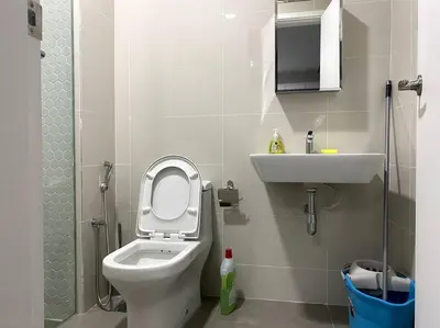 a bathroom with a toilet and a sink at Lucky Continew Residence 1 Bedroom - TRX KL in Kuala Lumpur