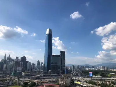 a view of a city with a tall skyscraper at Lucky Continew Residence 1 Bedroom - TRX KL in Kuala Lumpur