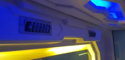 a room with a ceiling with a window and lights at Bestow Capsule Hostel in Kuala Lumpur
