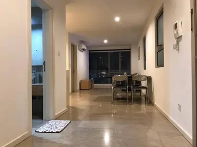 a hallway with a table and chairs in a room at Gorgeous Fairlane 2 Bedrooms - Bukit Bintang KL in Kuala Lumpur