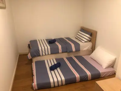two twin beds in a small room at Gorgeous Fairlane 2 Bedrooms - Bukit Bintang KL in Kuala Lumpur