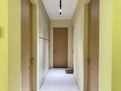 an empty hallway with a door and a tile floor at Legasi Kampung Baru KL Homestay in Kuala Lumpur