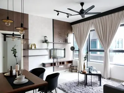a living room with a dining table and a tv at Stylish & Cozy 2BR Apt at Arte Plus, FREE Parking in Kuala Lumpur