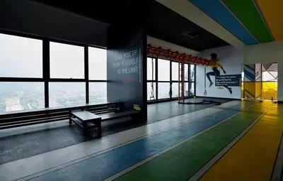 a bowling alley with a person jumping in the air at Stylish & Cozy 2BR Apt at Arte Plus, FREE Parking in Kuala Lumpur