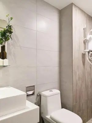 a bathroom with a white toilet and a sink at Stylish & Cozy 2BR Apt at Arte Plus, FREE Parking in Kuala Lumpur