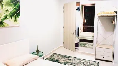 a white bedroom with a bed and a closet at 3 Bedrooms Short Stays Condo at KLCC in Kuala Lumpur