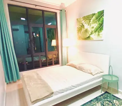 a small bed in a room with a window at 3 Bedrooms Short Stays Condo at KLCC in Kuala Lumpur