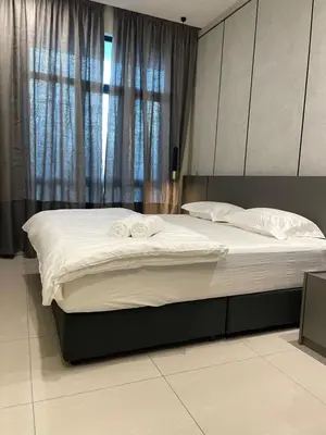 a large bed in a bedroom with a window at Legasi Kampung Bharu by Tulip in Kuala Lumpur