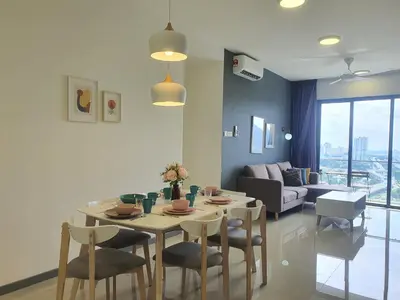 a living room with a table and chairs and a couch at United Point Residence 6 pax Near Mont Kiara Desa Park Kepong in Kuala Lumpur