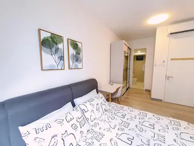 a bedroom with a bed and a room with a desk at United Point Residence 6 pax Near Mont Kiara Desa Park Kepong in Kuala Lumpur