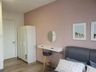 a bedroom with a bed and a desk and a mirror at United Point Residence 6 pax Near Mont Kiara Desa Park Kepong in Kuala Lumpur