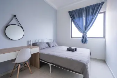 a bedroom with a bed and a desk and a window at Peaceful 3-bedroom with Pool 5 pax - Wangsa Maju in Kuala Lumpur