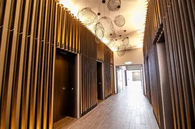 a hallway of a building with wooden walls at Eaton Residences KLCC by Plush in Kuala Lumpur